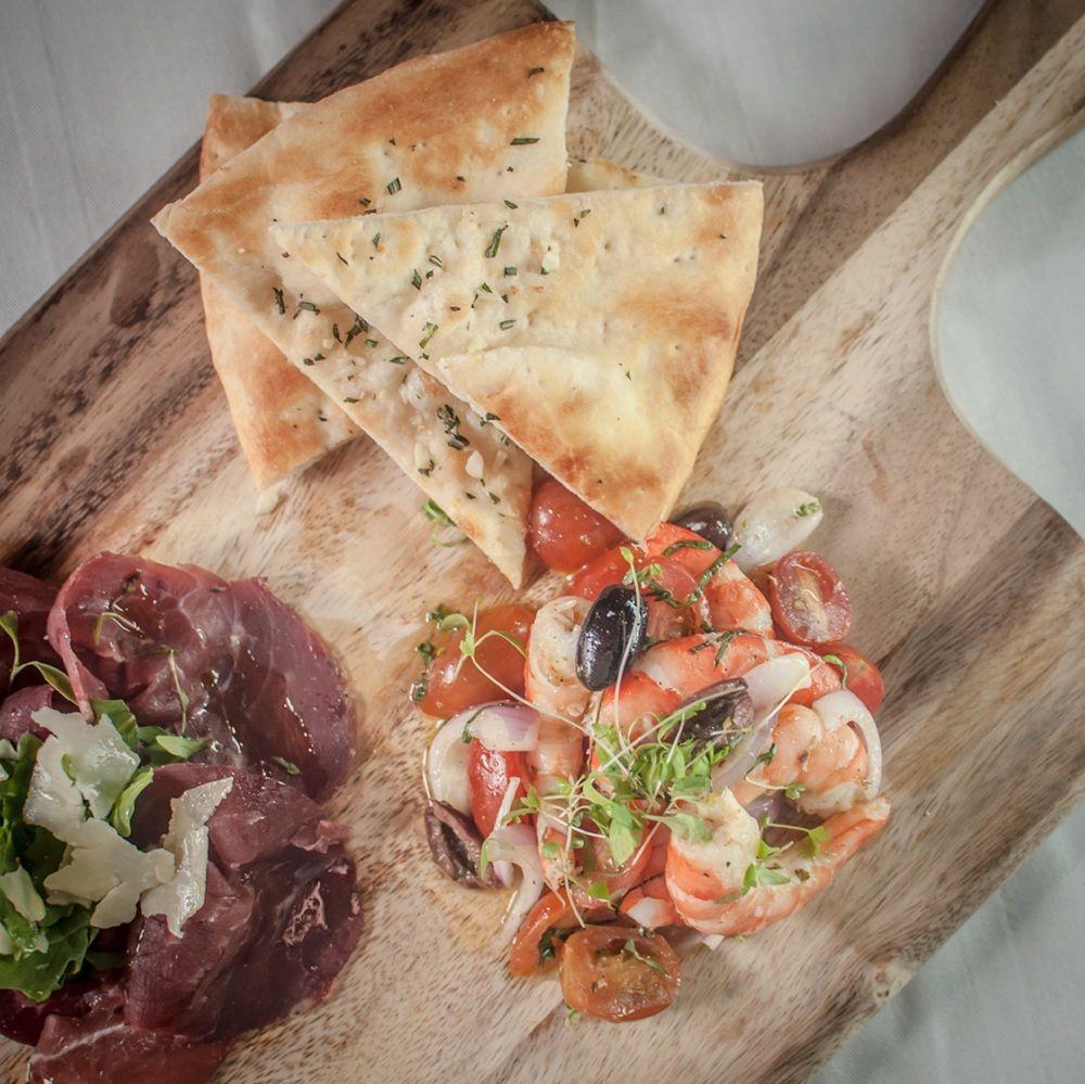 The Westin Kuala Lumpur Ξενοδοχείο Εξωτερικό φωτογραφία A prawn and tomato salad with a side of cured meat